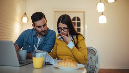 couple looking at their credit score for a USDA loan